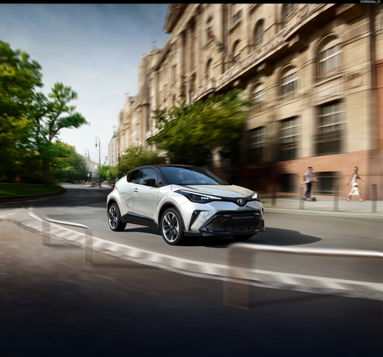 Toyota Corolla Hatchback driving down the road