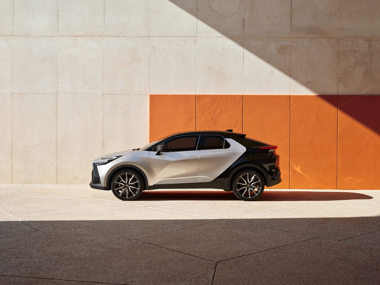 Toyota Corolla Hatchback driving down the road